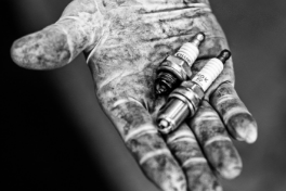 Hand with Spark Plugs