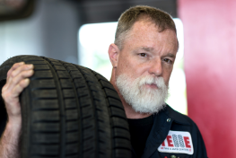 Telle Tire mechanic with tire